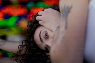 a close up of a person with a tattoo on her arm