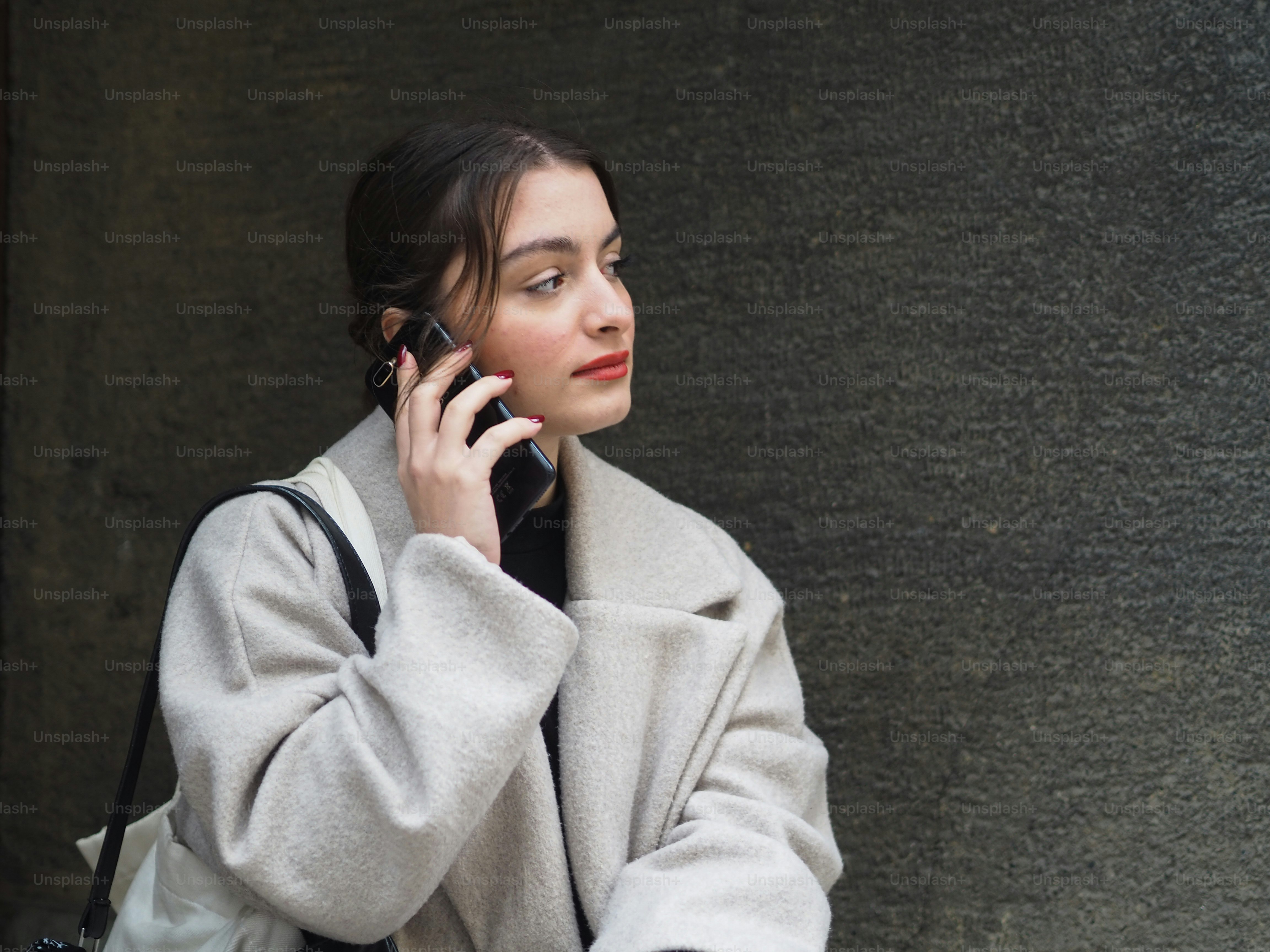 a woman is talking on a cell phone