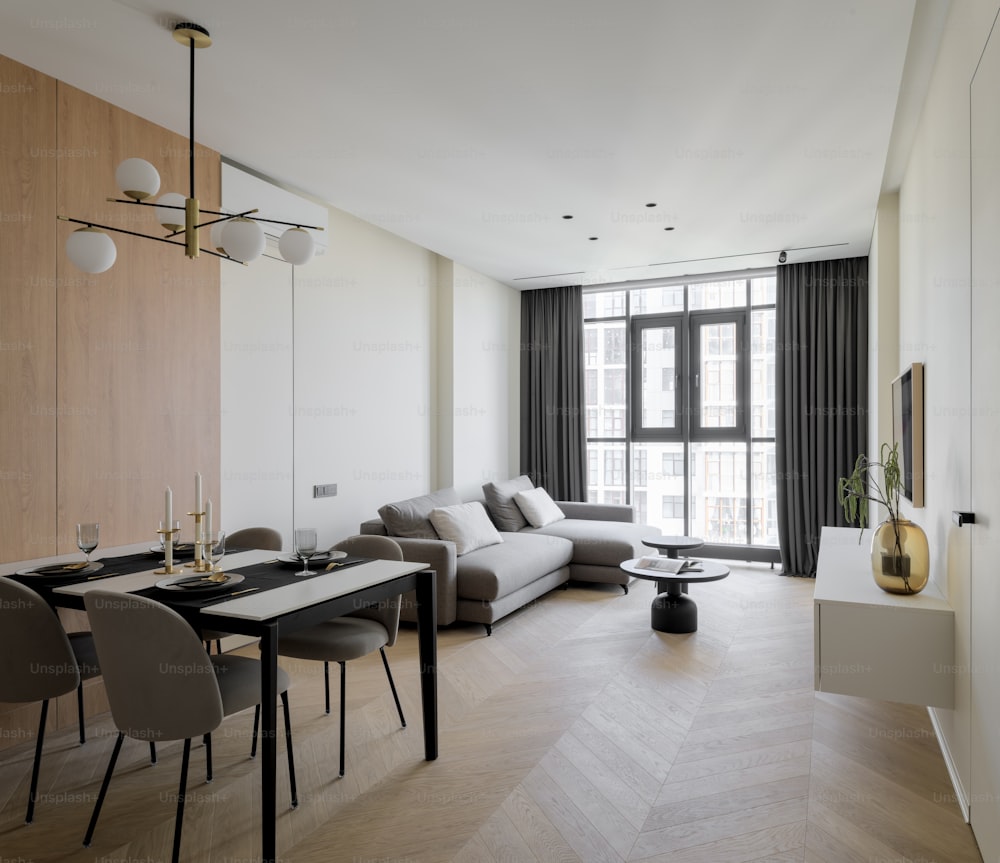 a living room filled with furniture and a large window