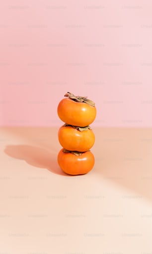 a stack of oranges sitting on top of each other