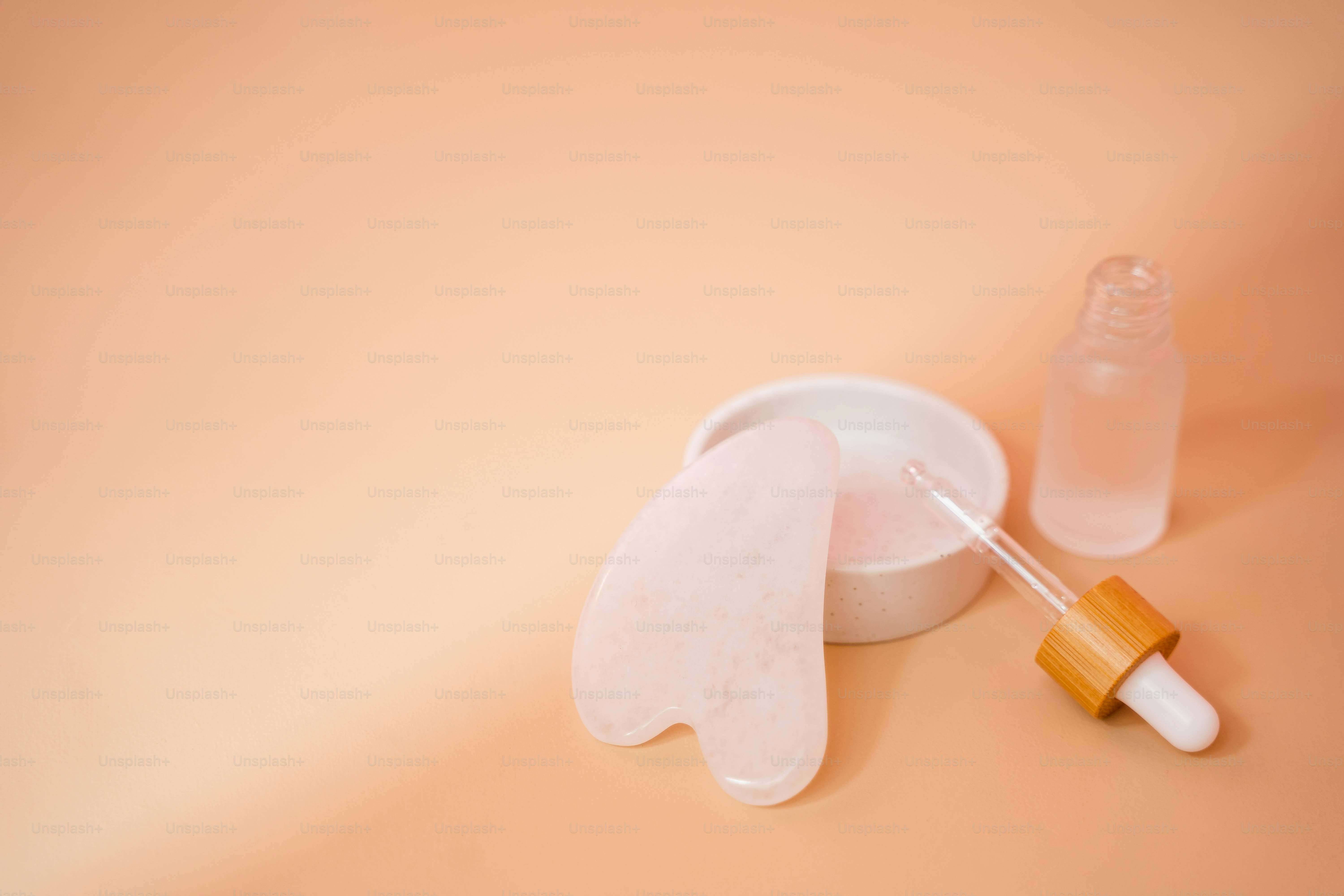 a bottle of liquid with a dropper next to it