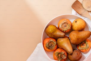 a white bowl filled with different types of fruit