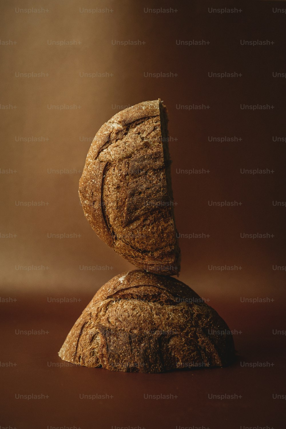 a piece of bread sitting on top of a rock