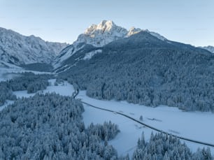 a snow covered mountain with a river running through it