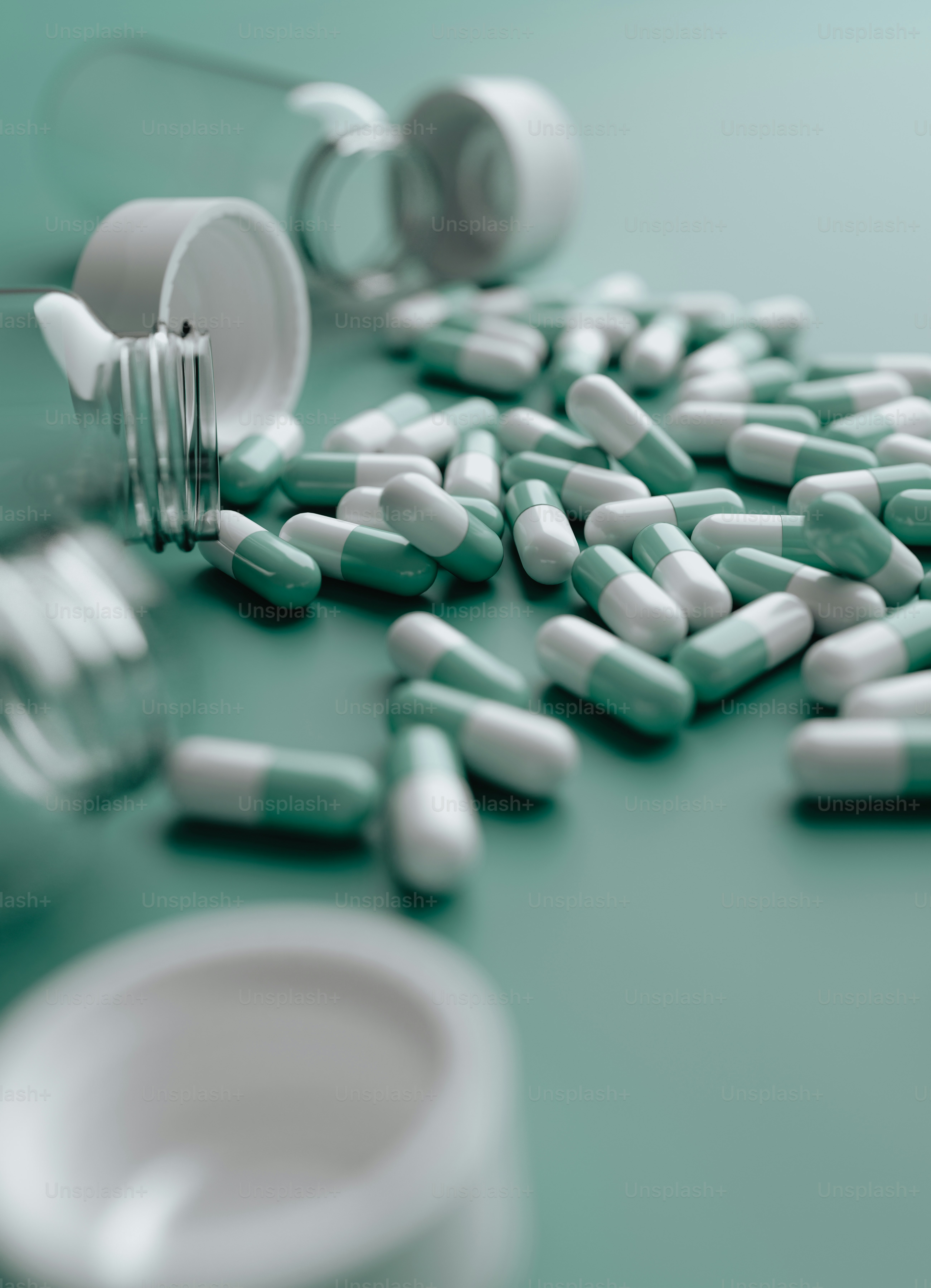 pills spilling out of a bottle onto a table