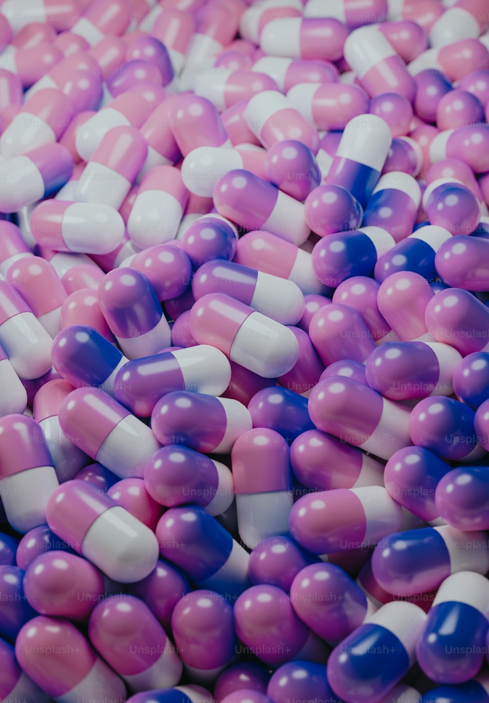 a pile of pink, white and blue pills
