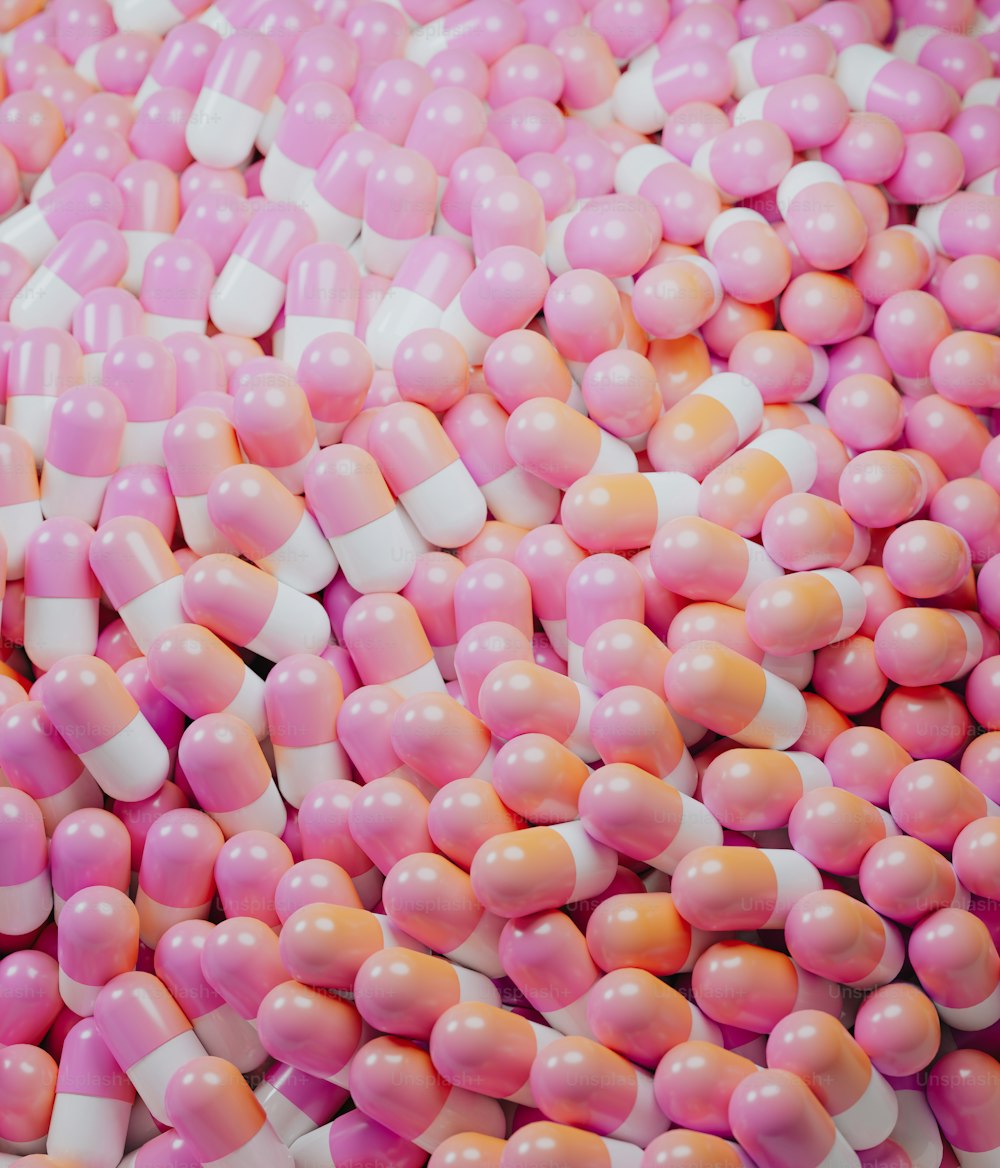 a pile of pink and white candy canes