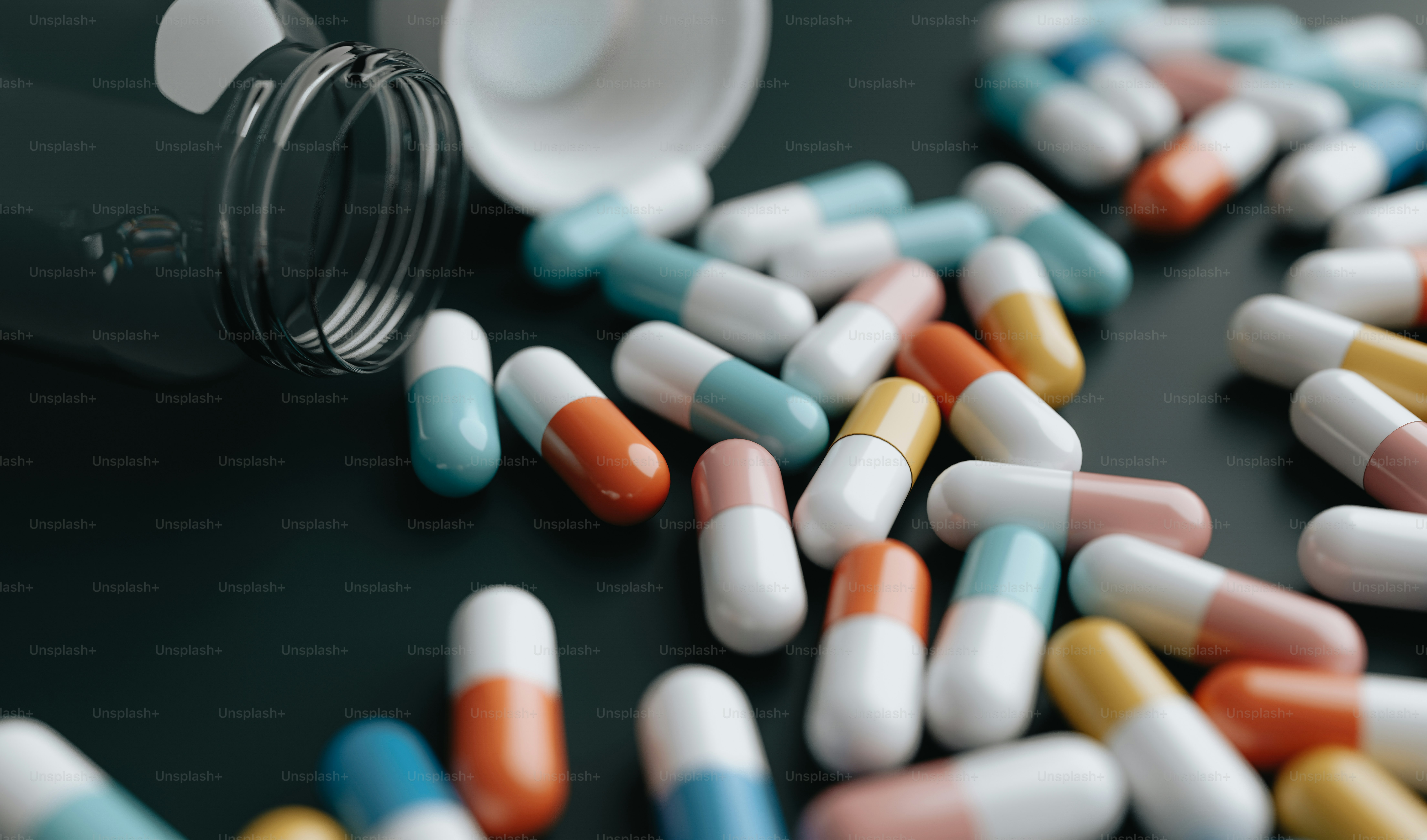 a close up of a bottle of pills on a table