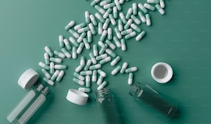 píldoras que se derraman de una botella sobre una superficie verde
