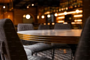 a table and chairs in a room with a checkered floor