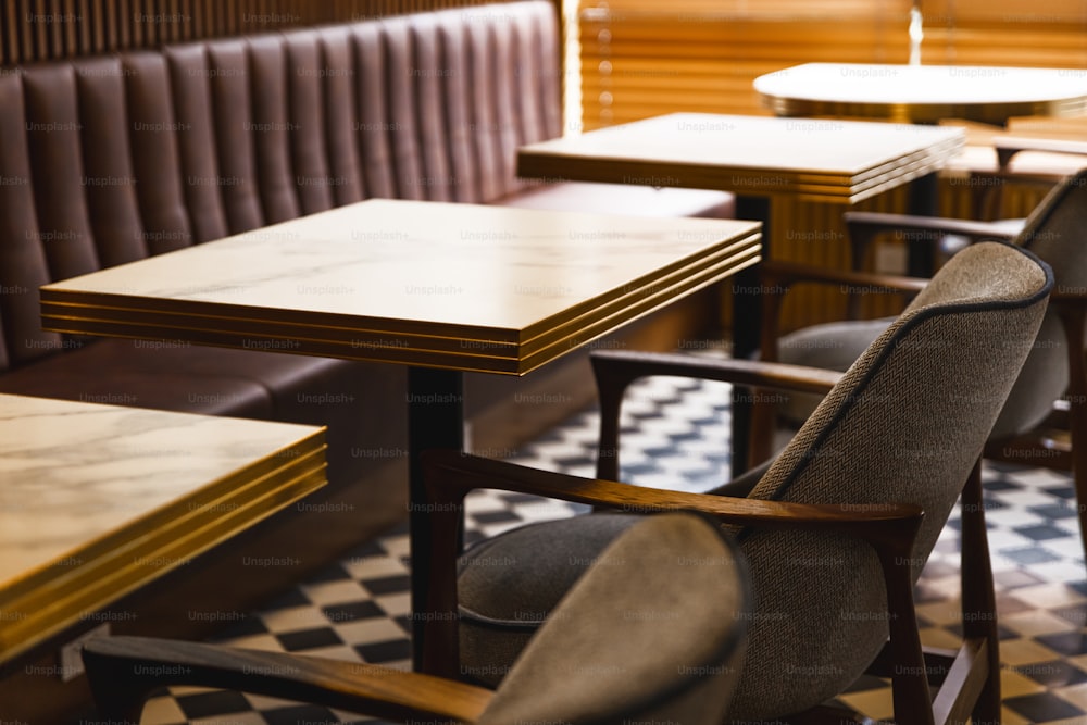 a restaurant with a checkered floor and wooden booths