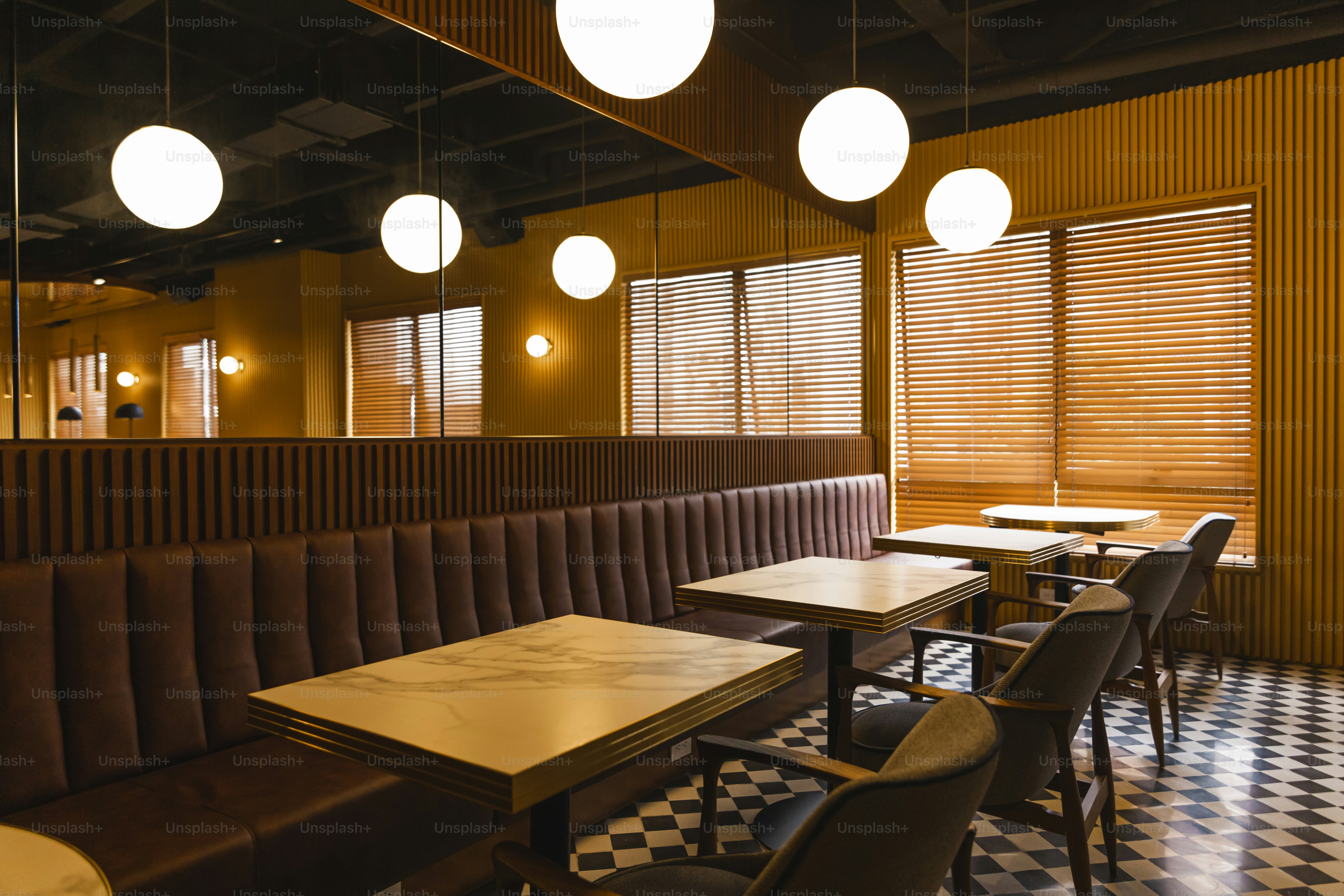 a restaurant with a checkered floor and wooden booths