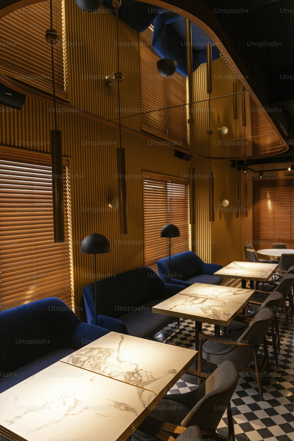 a restaurant with a checkered floor and wooden walls