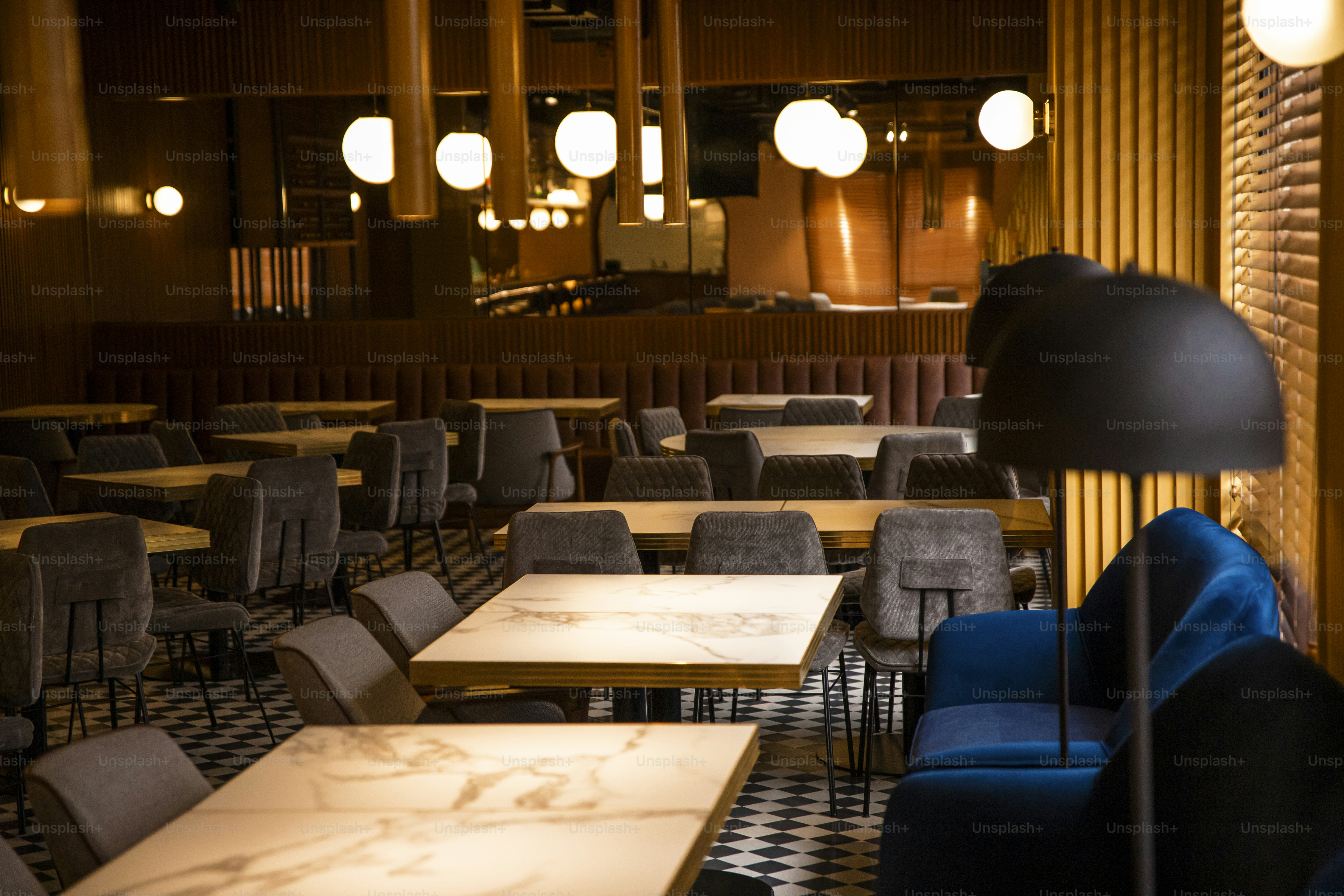 a restaurant with a checkered floor and tables and chairs