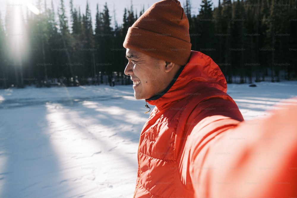 a man wearing a red jacket and a red hat