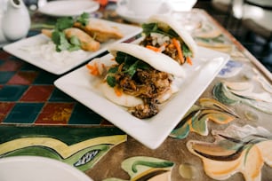 a table topped with two plates of food