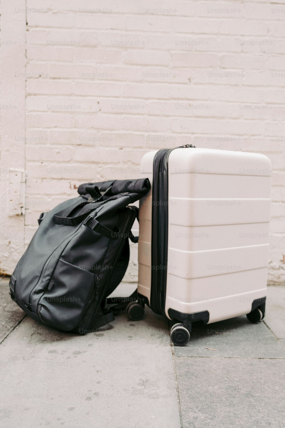 two pieces of luggage sitting next to each other