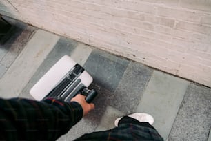 a person standing next to a white stove top oven