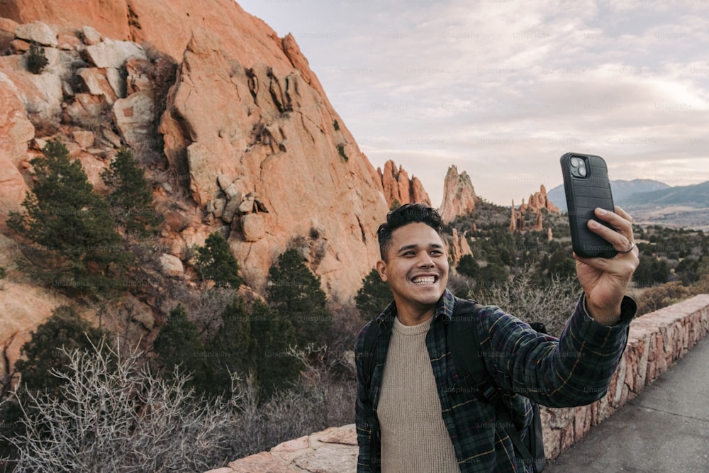 a man taking a picture with his cell phone