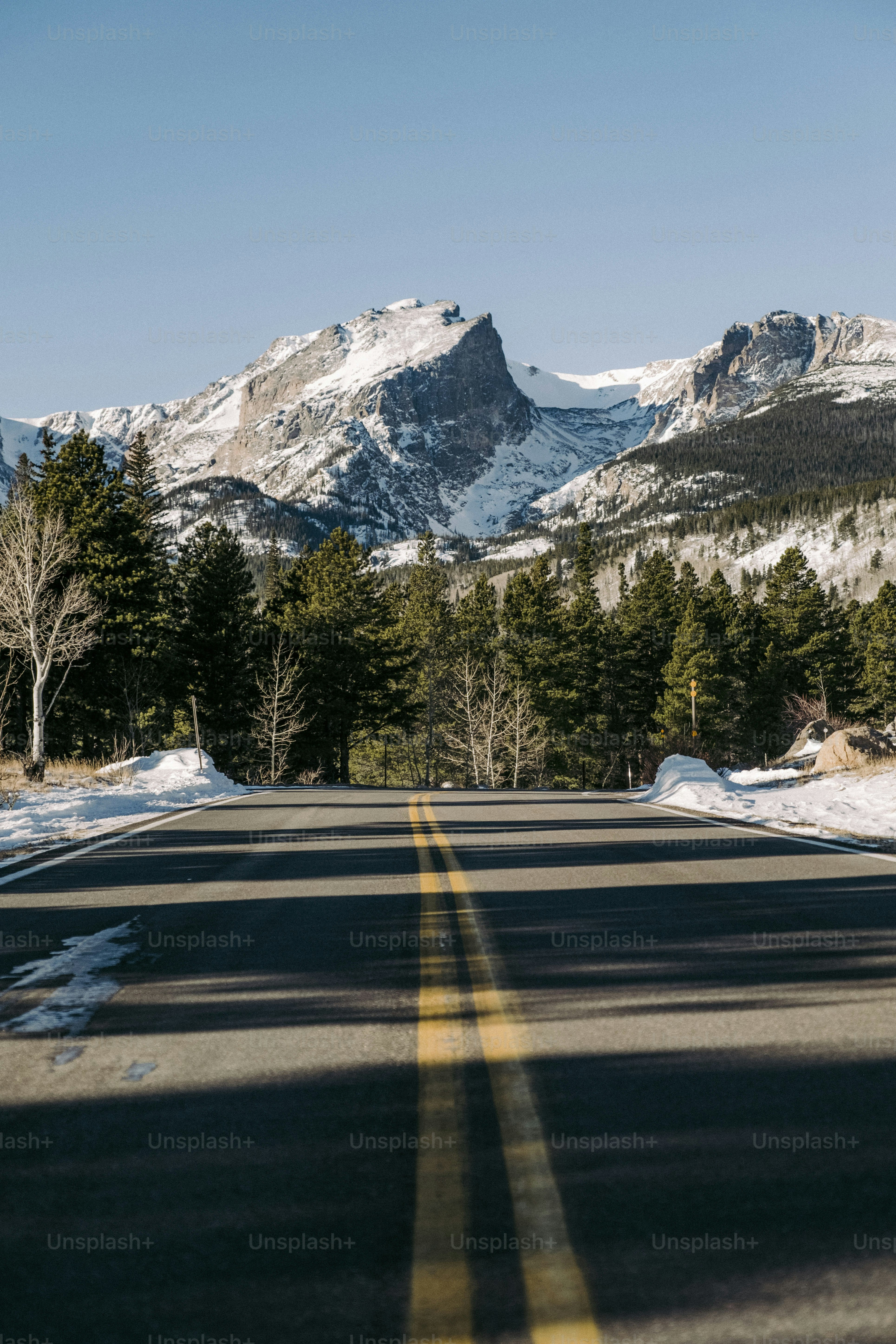 a view of a road with mountains in the background