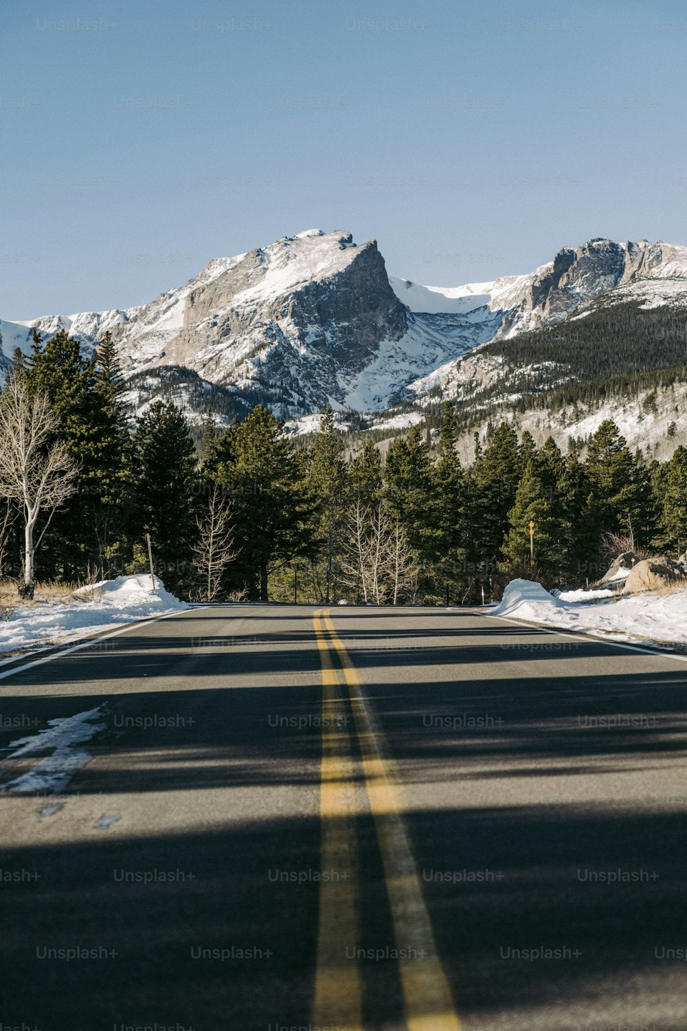 a view of a road with mountains in the background