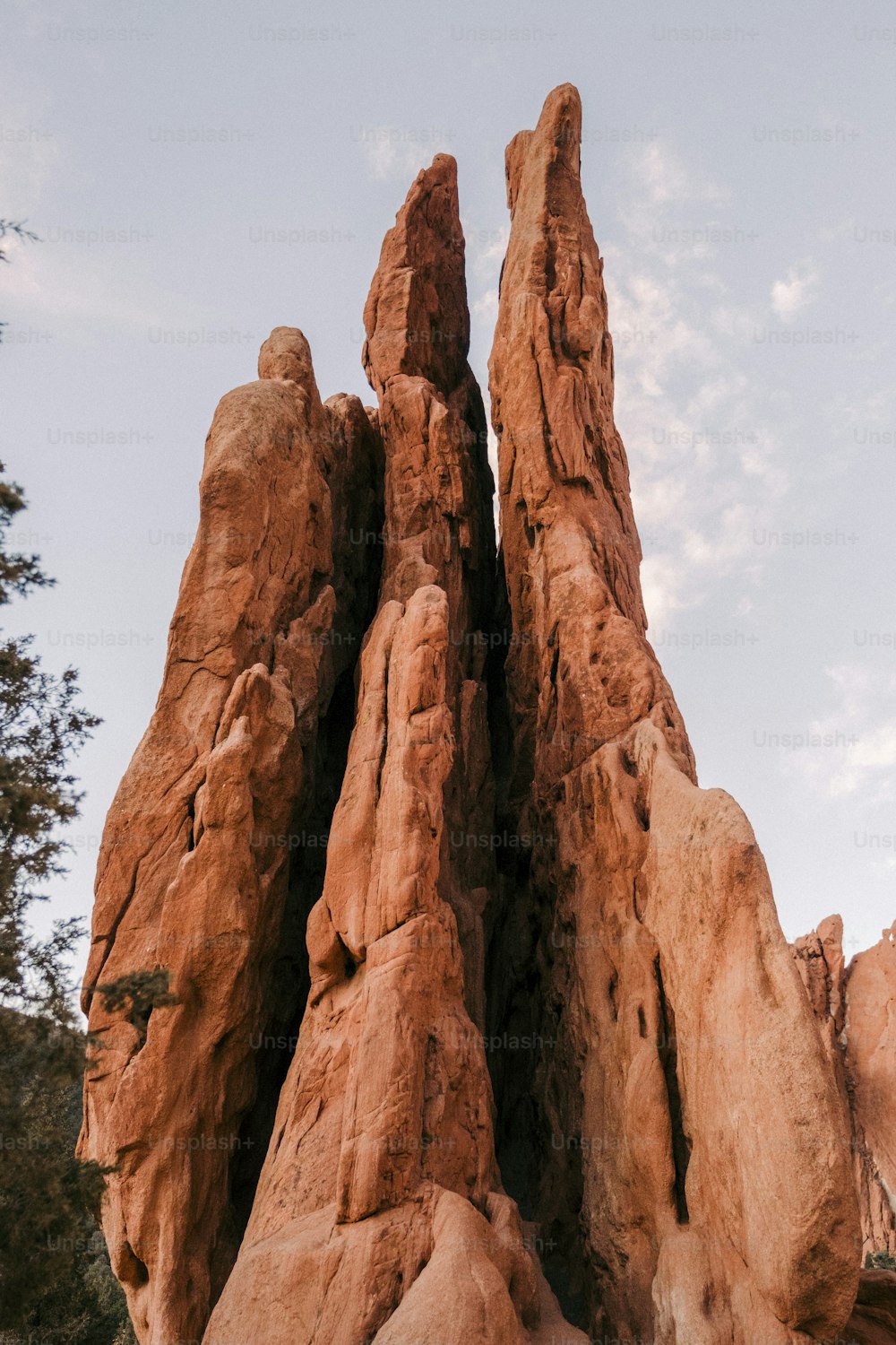a large rock formation with a sky background