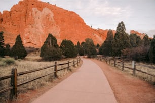 a path leading to a large rock formation