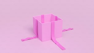 una caja rosa con una cinta atada alrededor