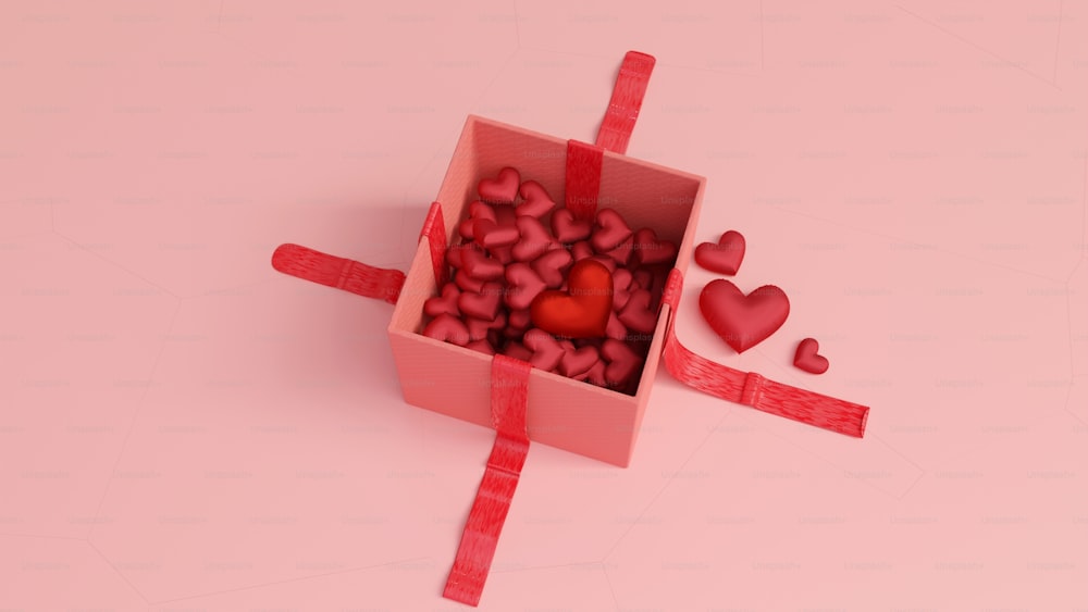 a pink box filled with lots of red hearts