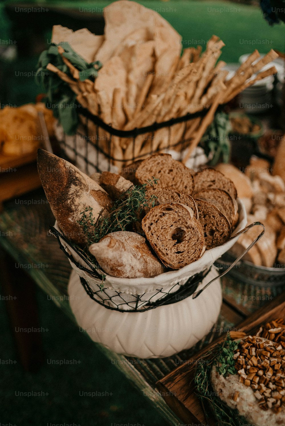 a table topped with lots of different types of bread