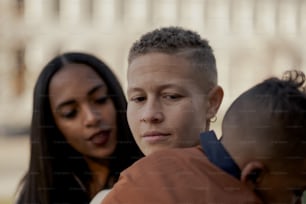 a woman and a boy are looking at something