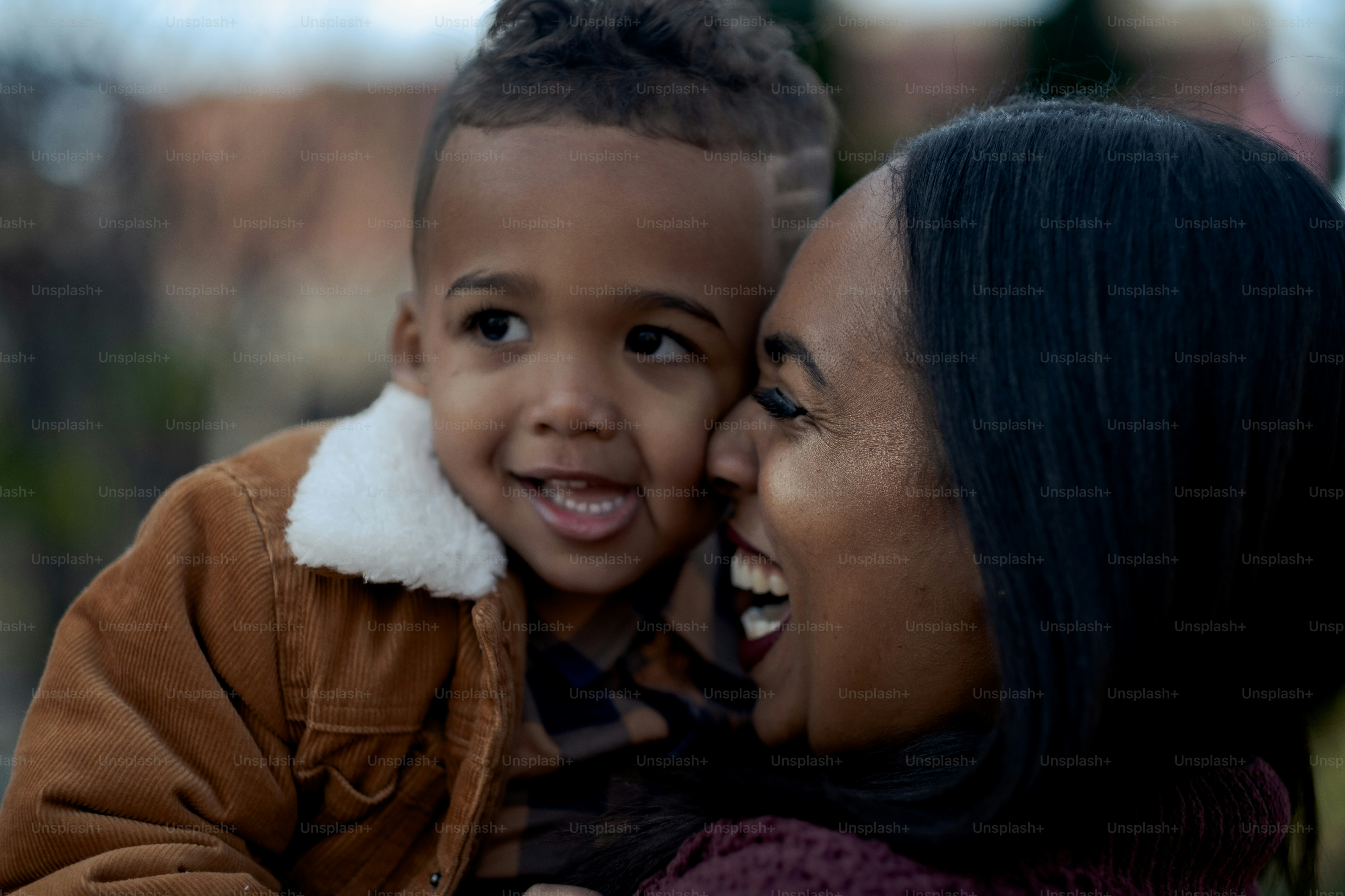 a woman holding a small child in her arms