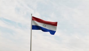 a flag waving in the wind on a cloudy day