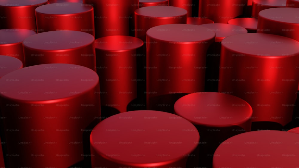 a large group of red stools in a room