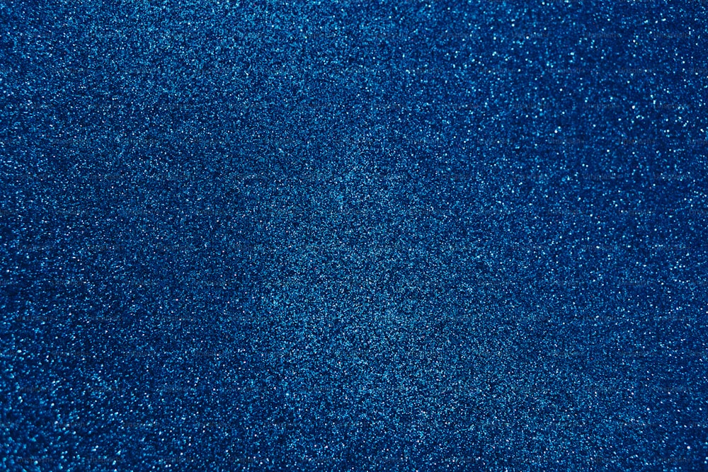 a dark blue background with small speckles