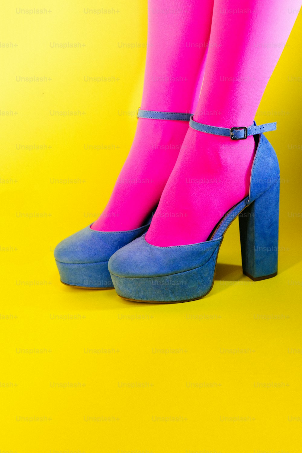 a pair of pink and blue high heeled shoes