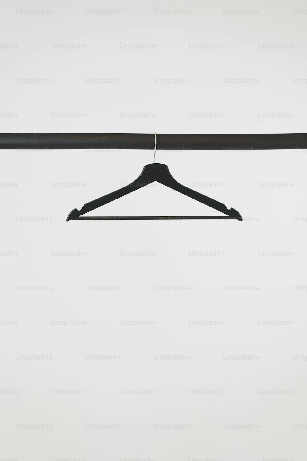 a black coat hanger with a white background