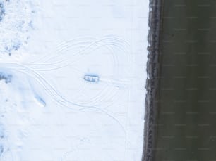 an aerial view of a snow covered field