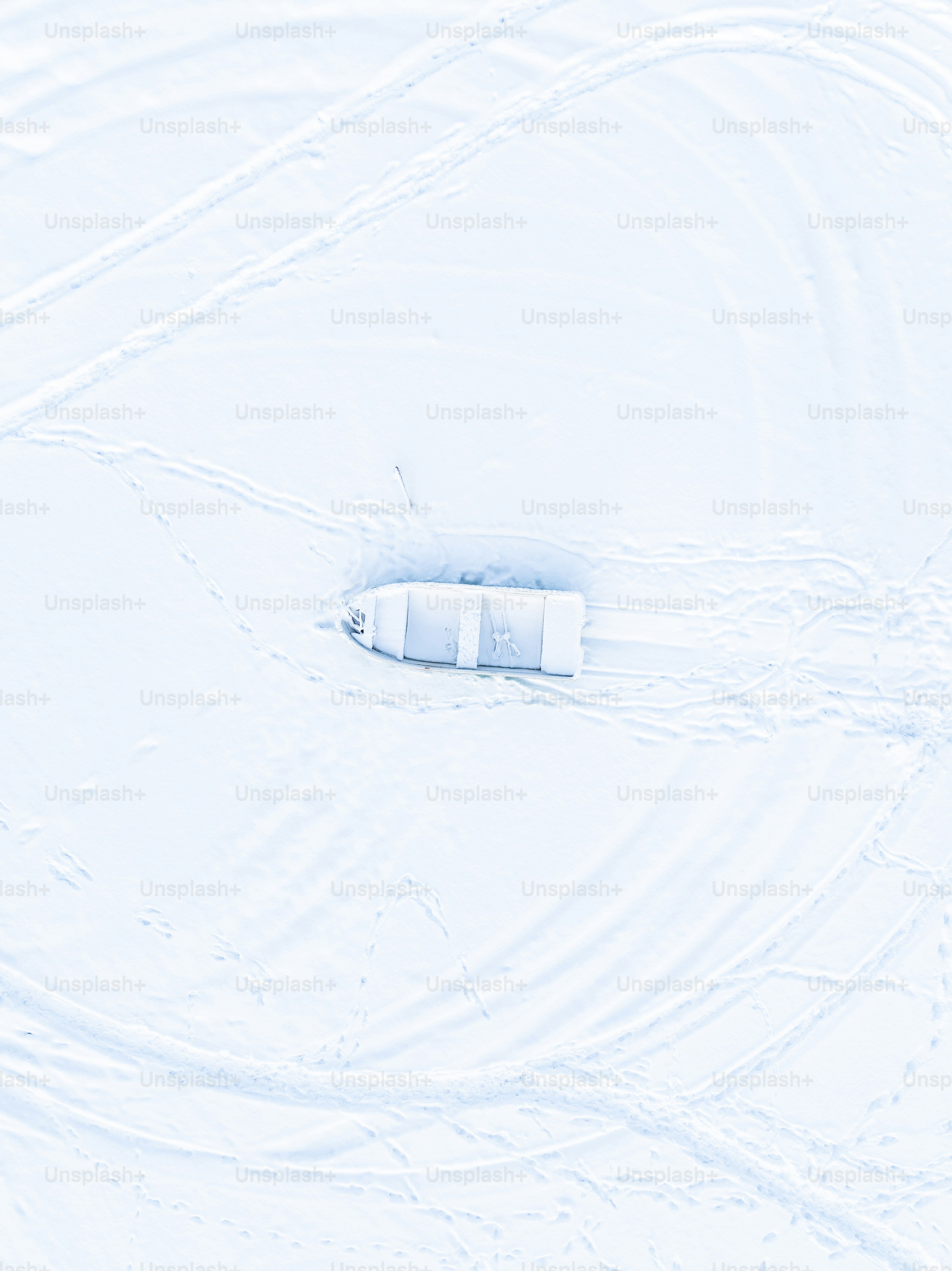 an aerial view of a snow covered field