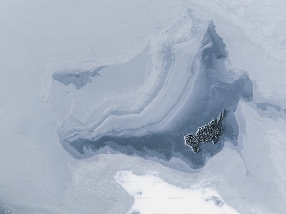 an aerial view of a snow covered area