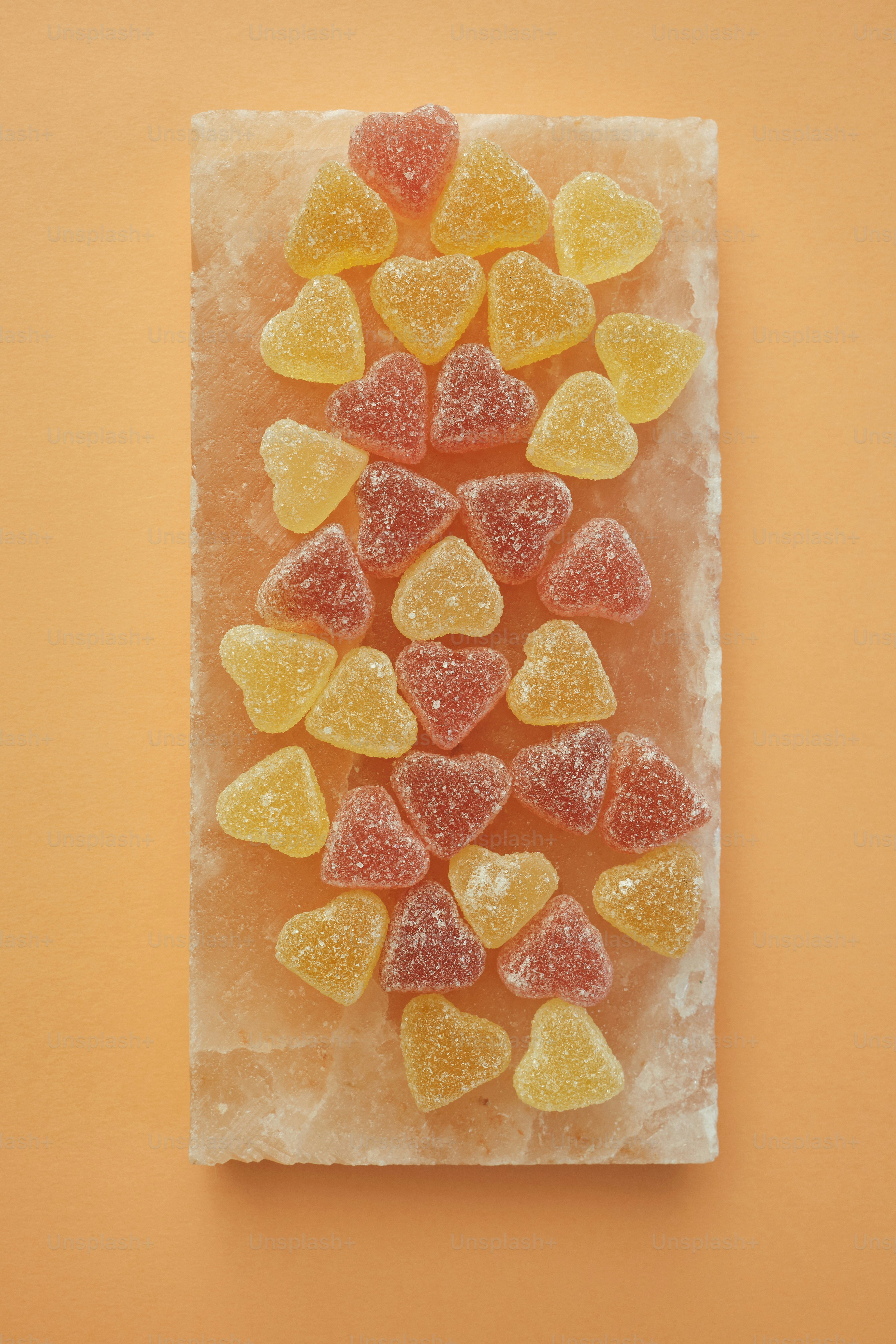 gummy bears arranged on a piece of ice