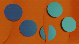 a group of blue circles sitting on top of an orange wall