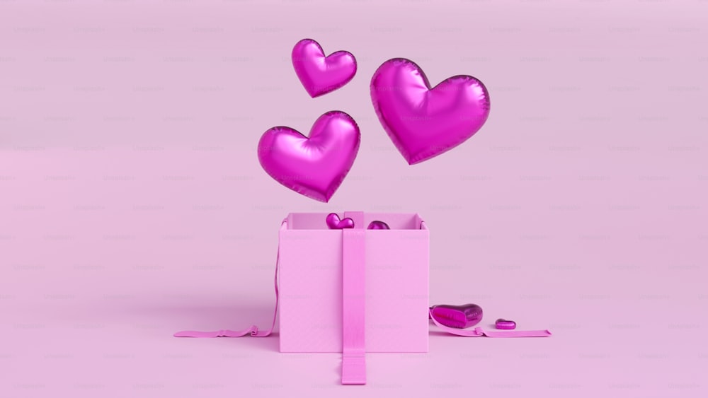 a pink box with hearts floating out of it