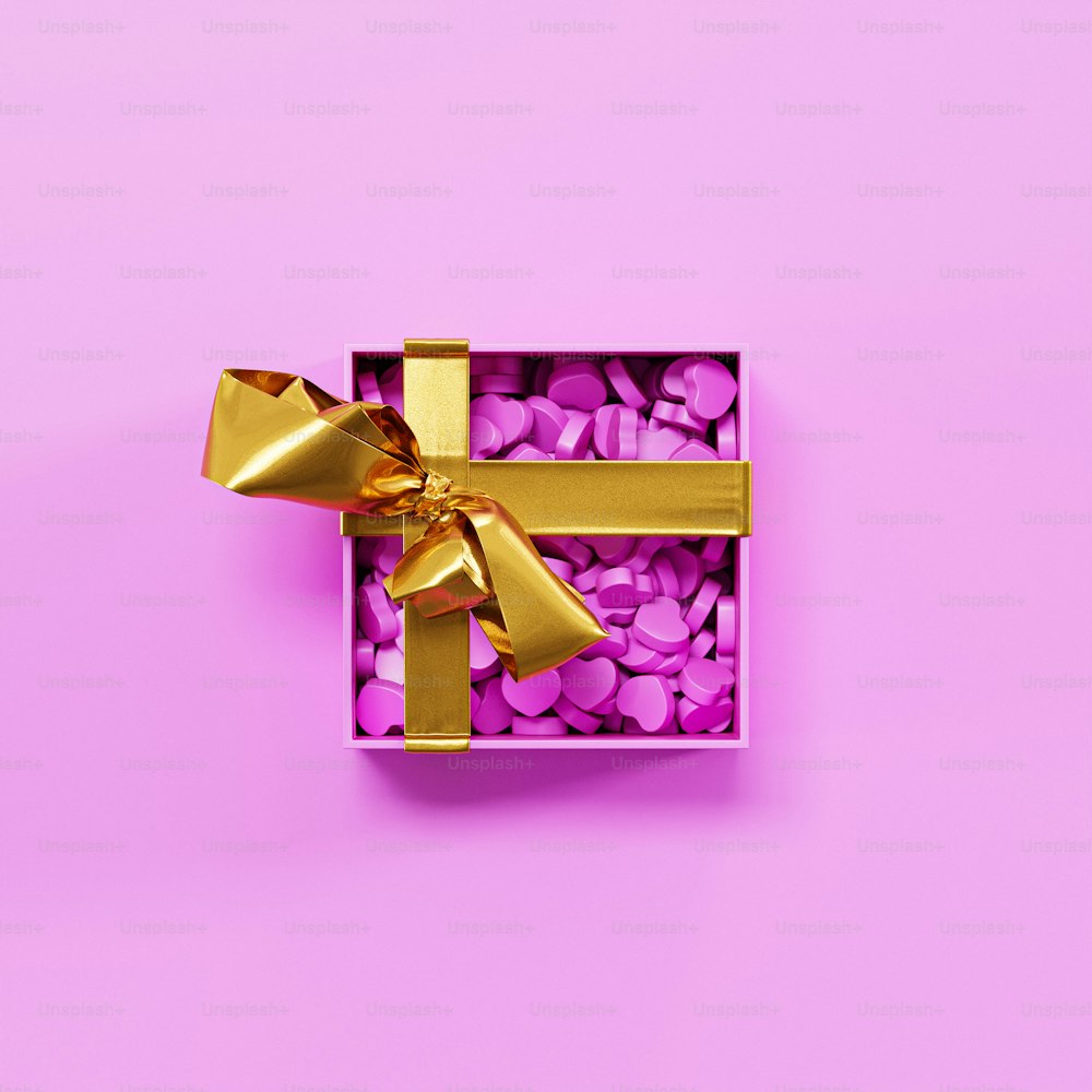 a purple box with a gold bow on it