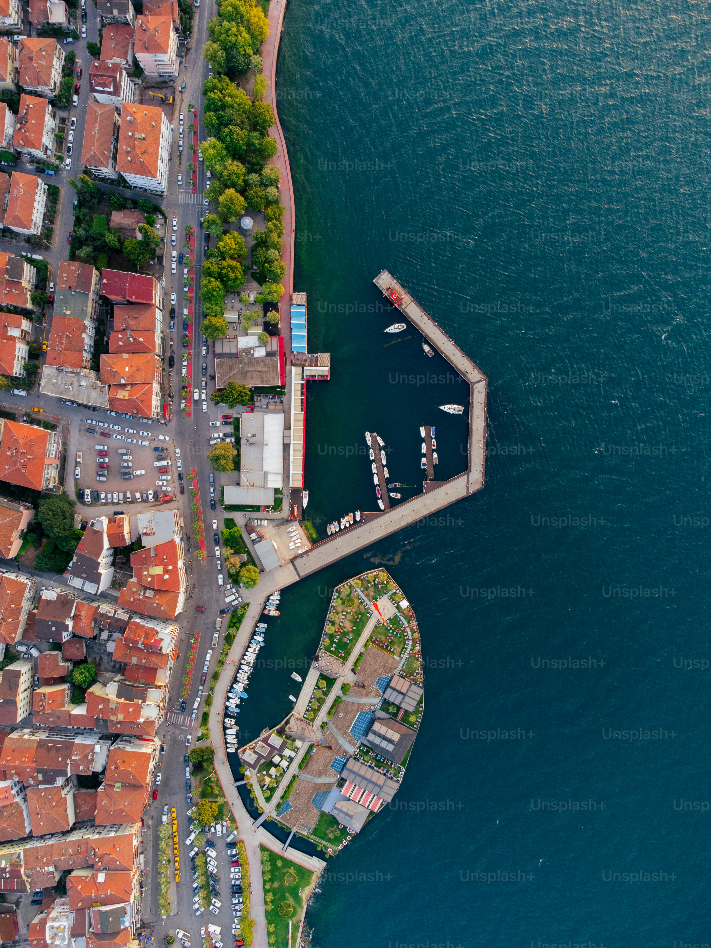 an aerial view of a city by the water