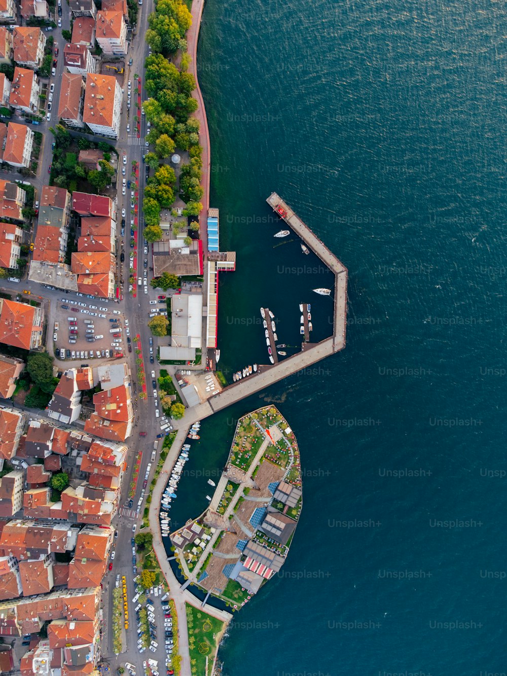 an aerial view of a city by the water