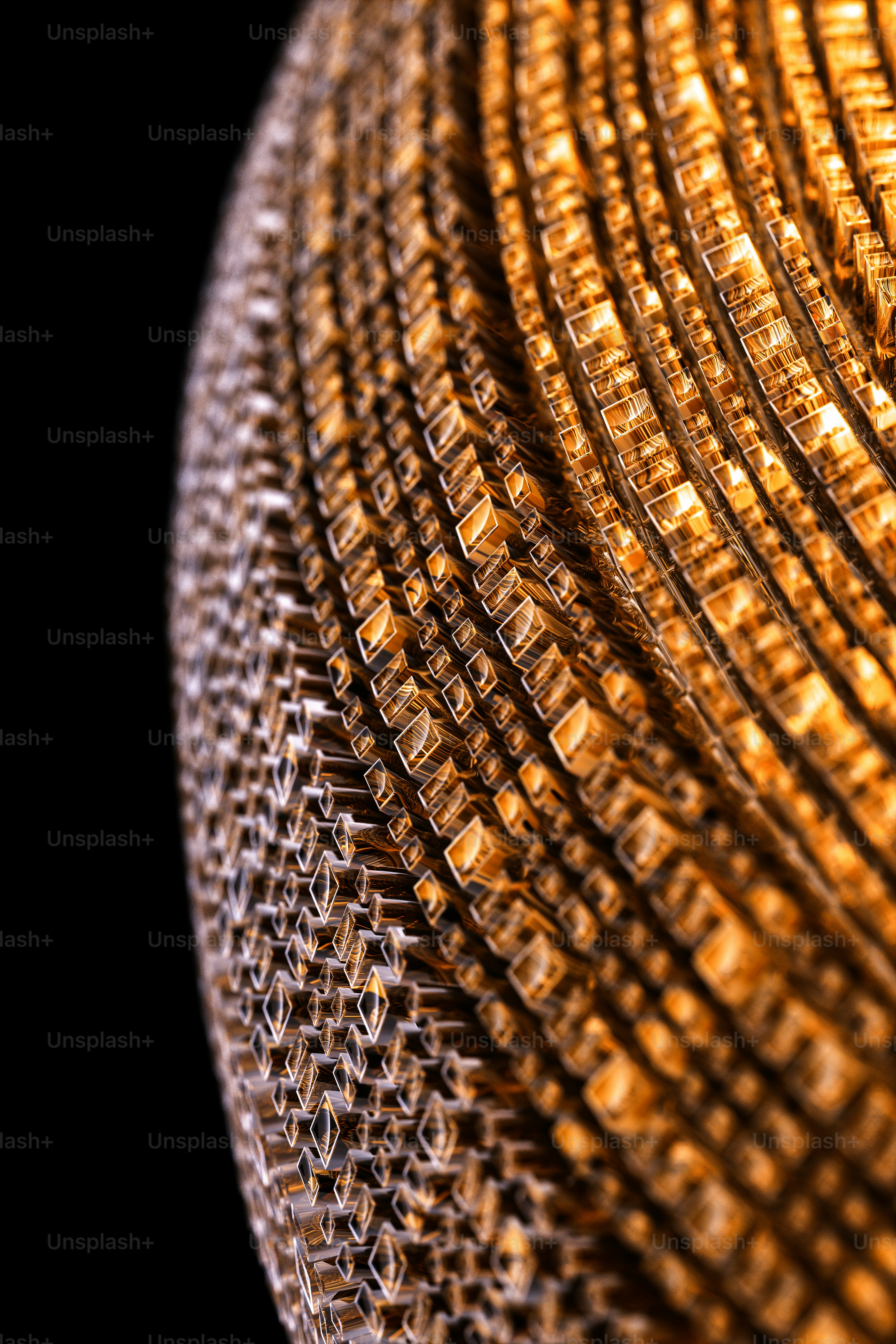 a close up of a metal object on a black background