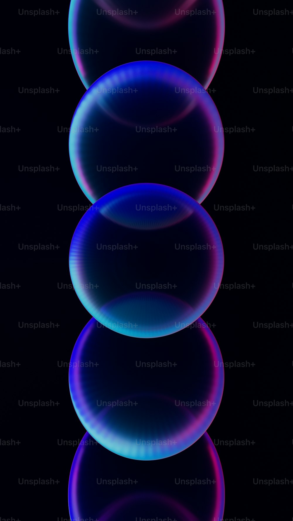 a row of blue and pink circles on a black background