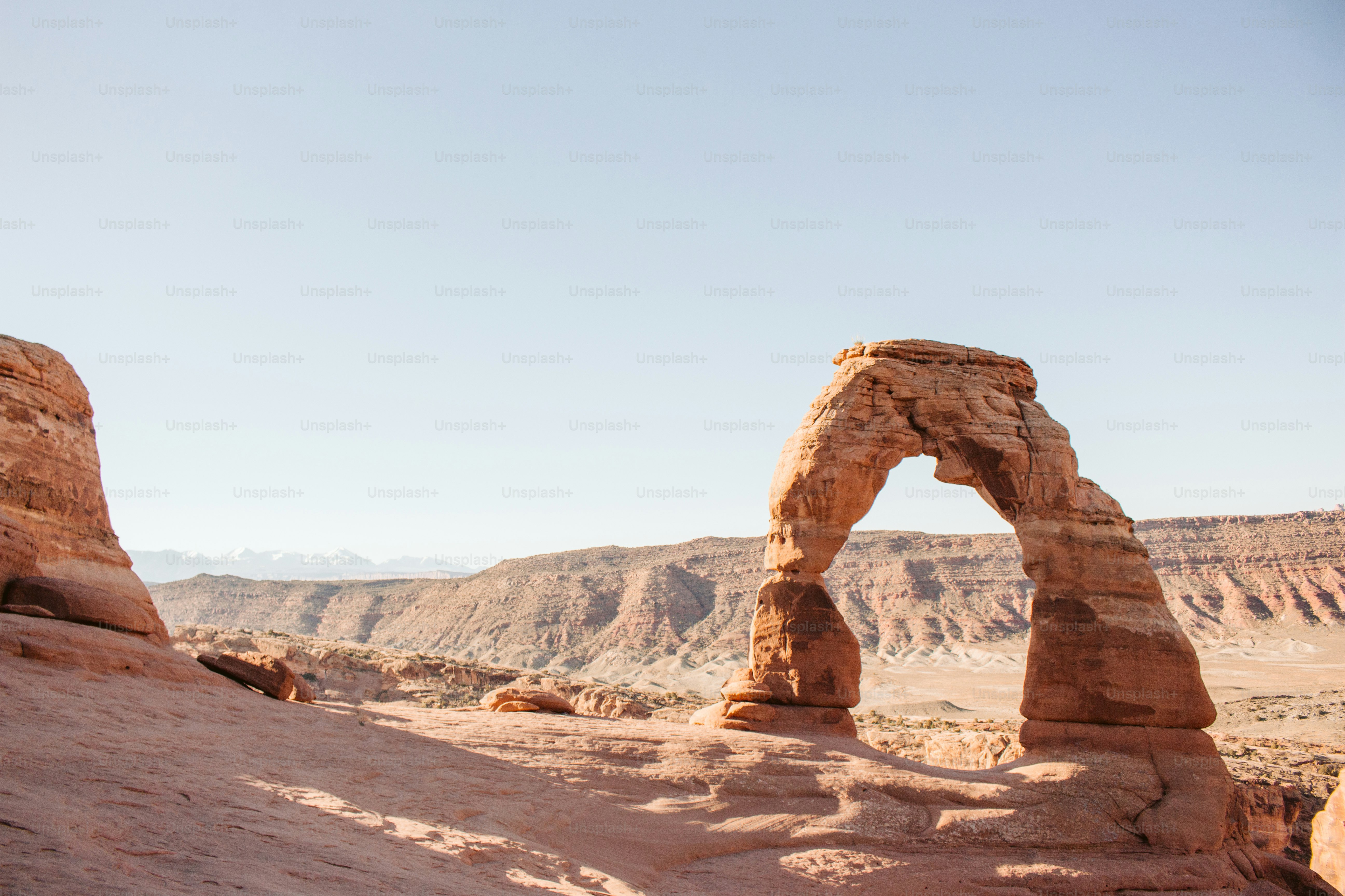 a large rock formation in the middle of a desert