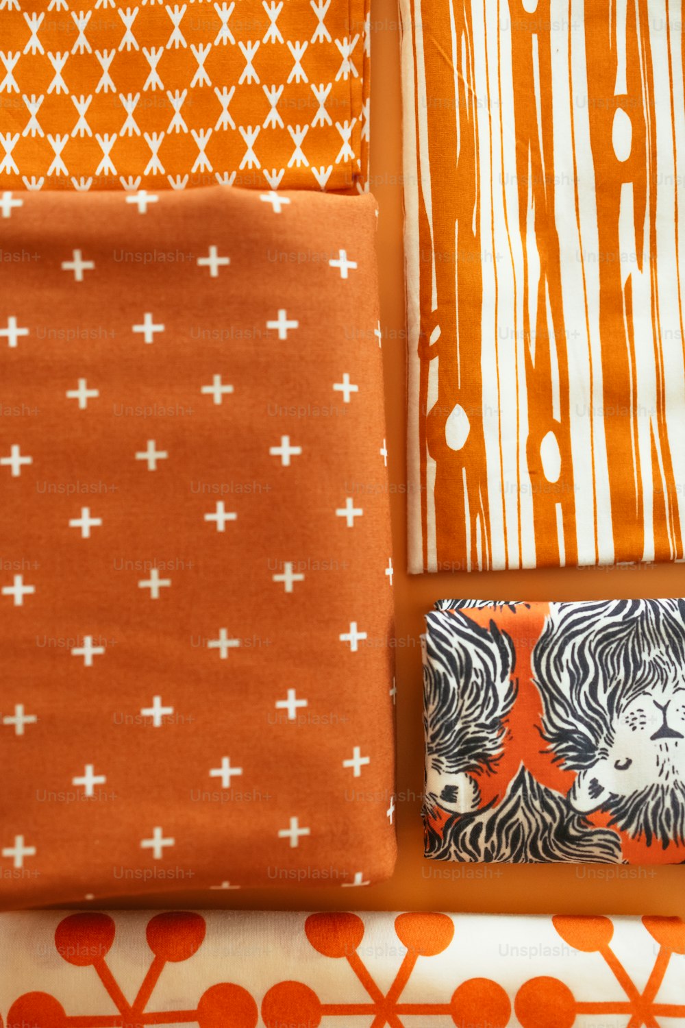 a collection of orange and white fabric